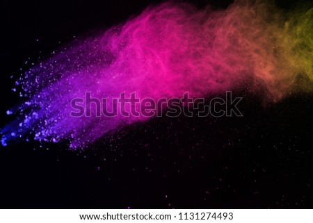 abstract colorful powder splatted isolated on black background, Freeze motion of color powder. Exploding color powder or color glitter texture on black background.