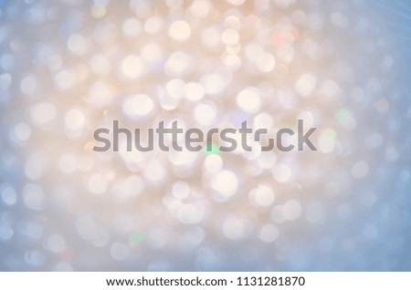 Blurred snow lights. Bokeh light festive backdrop. Abstract blurred pastel background