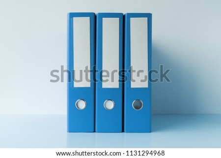 Blue file document ring binders in accountant and bookkeeping business office Royalty-Free Stock Photo #1131294968