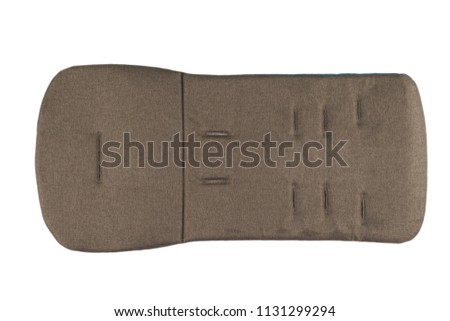 Mattress for a baby stroller on a white background.