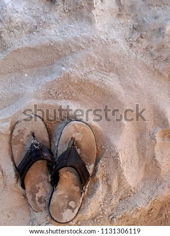 Sandals on the beach with copy space