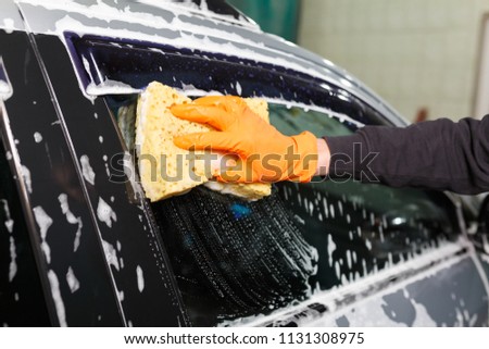 A foamy process of washing a car