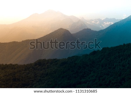 Italian Alps with overlay light effects.