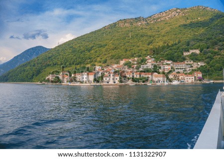 Amazing landscape view of the coastal villages in Kotor Bay. Summer Mediterranean landscape in Montenegro, view of Bay of Kotor, Adriatic Sea near Tivat city