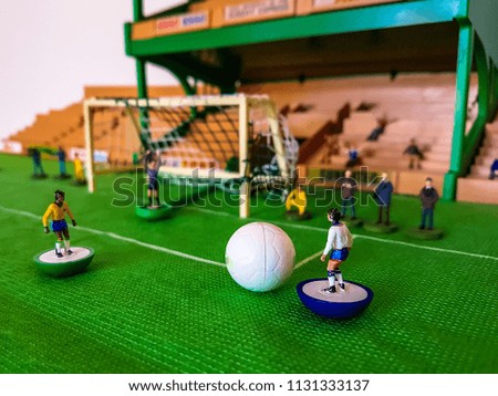 World Cup Subbuteo football figures lined up on a grass football field, England v Brazil