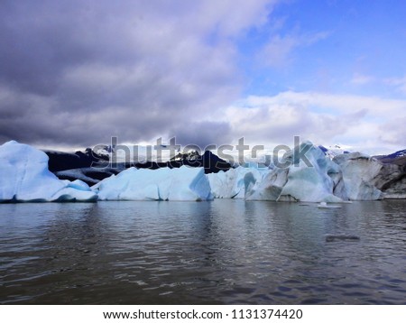 
Icebergs floating in Fjarsarlon iceberg lagoon.					