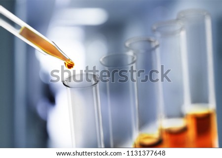 Oil in glass lab tube