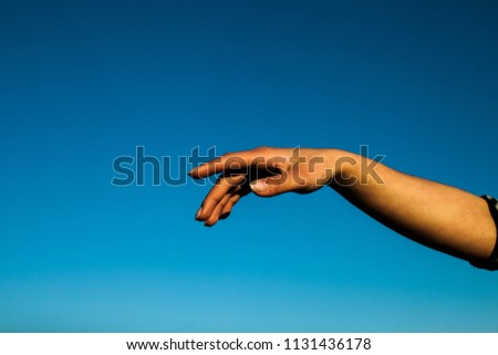hands holding the sun at dawn
