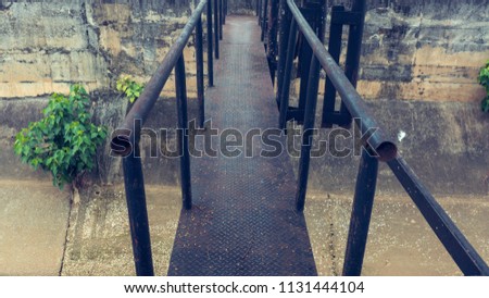 Steel bridge cross to canal in city