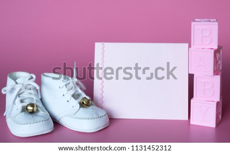 Pink Baby Girls Baby Shower or Birth Announcement Card with Vintage Shoes and Blocks.  Horizontal photo with side angled view and with room or space for copy, text, or your words on the card.