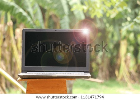 laptop on wood table background 