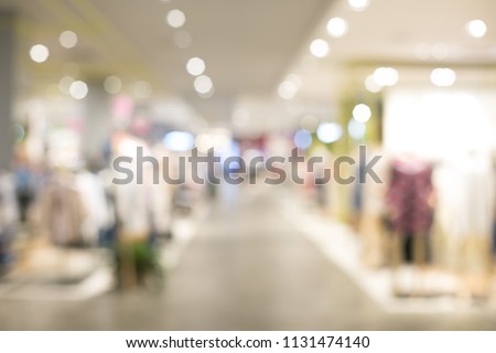 Big shopping mall has many products. Beautiful clothes to choose from. Everything is available. Popular people walk and shop.The atmosphere is cool, suitable for relaxing. Blur picture