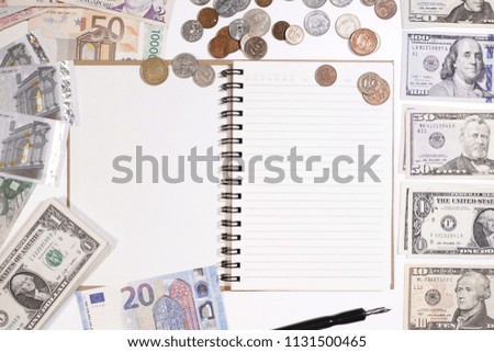 close up of banknote and coin with notebook for background                                            