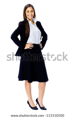 Full length portrait of a confident businesswoman in a suit and heels isolated on white background