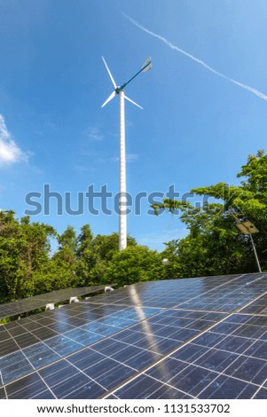 solar panels and wind turbines generating electricity in power station