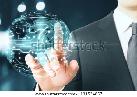 incformation and communications technology concept with businessman touching digital globe with hardware microcircuit. 