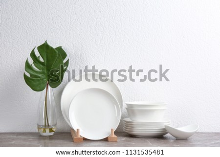 Set of new ceramic dishware on table Royalty-Free Stock Photo #1131535481
