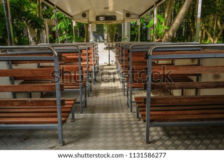 the classic pattern wooden seating tram open air