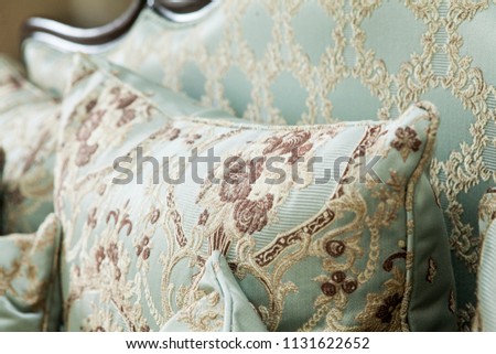 Pillow on the classic couch, baroque, rococo, vintage. Luxurious classical furniture background. Royalty-Free Stock Photo #1131622652