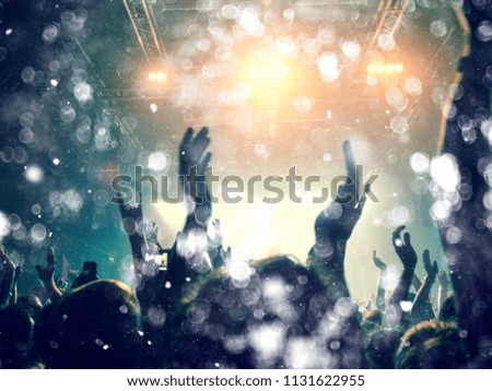 Silver lights on a concert crowd