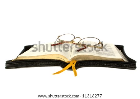 open book / bible and glasses on white background