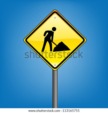 Yellow diamond hazard warning sign against blue sky - under construction warning sign