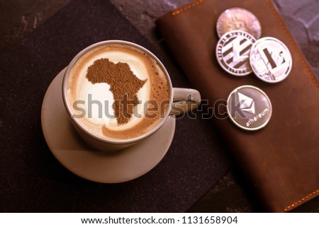 cup of coffee cappuccino with a picture of Africa on milk foam Royalty-Free Stock Photo #1131658904