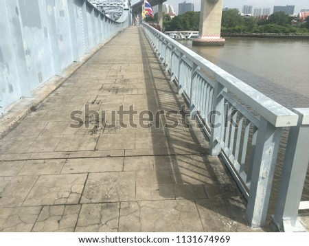 walkway with railing on the bridge