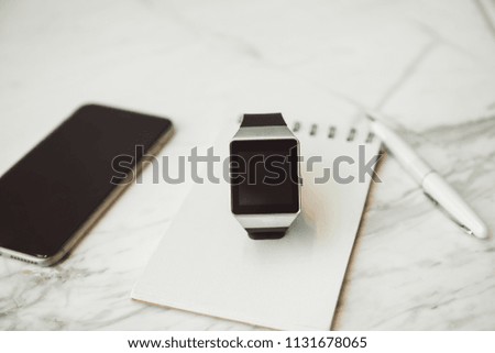 Unknown smart wrist watch laying on the table