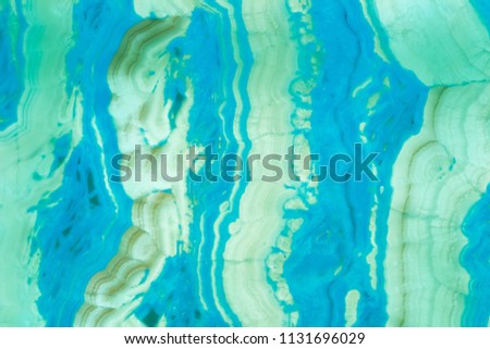 Natural stone glass background of multicolored stripes blue green