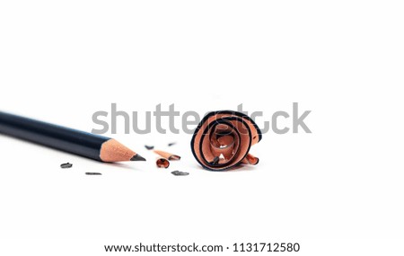 Wooden Pencil And Pencil Shavings Isolated On White Background. Macro Photography