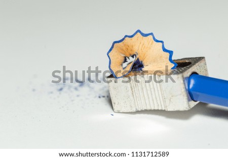 Sharpener, Blue Wooden Pencil And Pencil Shavings Isolated On White Background. Macro Photography 
