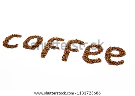 Word of coffee lined with coffee beans on white background