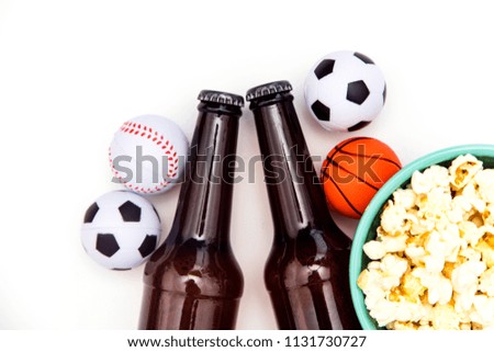 Sports match party. Beer bottle with football, basketball, baseball balls