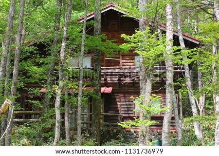 Wooden mountain house in forest of Chubu Sangaku National Park, Kamikochi, Nagano, Japanese Alps
