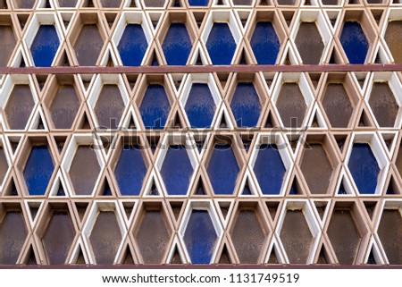 Hexagonal patterned wall with colored glassed with Magen David shape