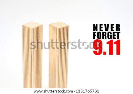 Creative poster in honor of September 11, skyscrapers of the World Trade Center carved wood breadboard models. Memory of the attack