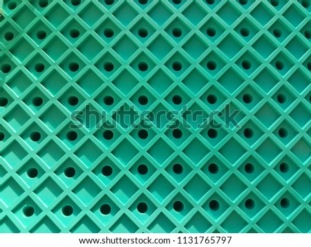 Green grid, lines in the form of a square. Pattern background, texture. Royalty-Free Stock Photo #1131765797