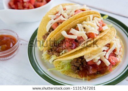 delicious Tacos on white wooden table