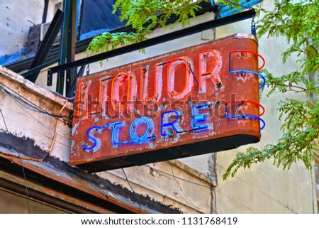 Vintage consummate Liquor store neon sign on  building in down town Manhattan, New York USA