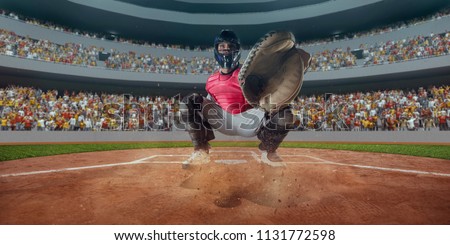 Baseball player catcher takes the ball from pitcher on professional baseball stadium