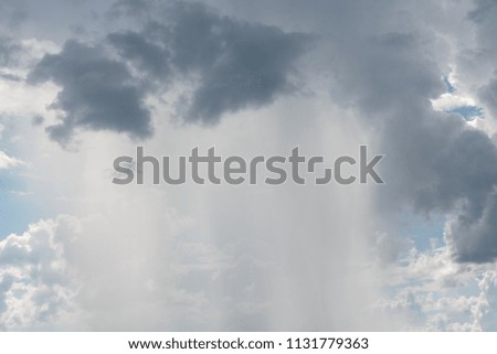 picture of rain coming out of cloud seem from far away