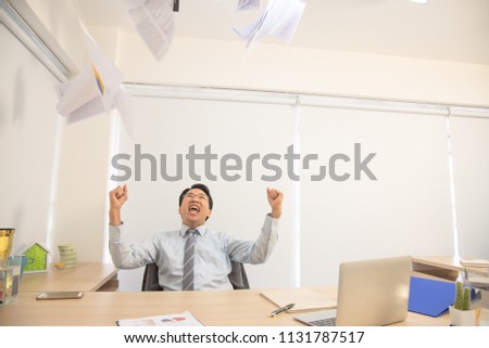 Businessman without concern and successful,the people throw paper in the air with happiness,No stress. cheerful ideas and happiness concept.