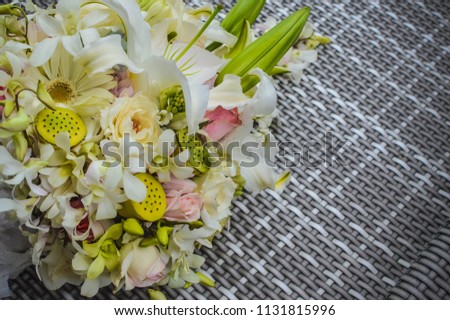 Photo of a framing floral flower bouquet on the handwoven mat that can be used for mock ups, backgrounds and card design