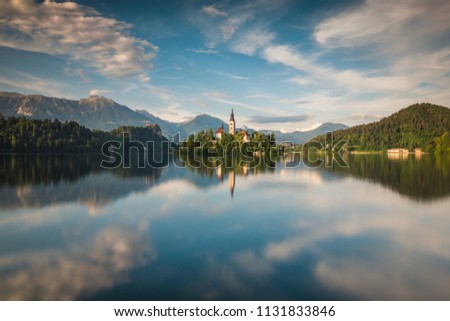 Church on the island on Lake Bled and his reflection in water, Slovenia