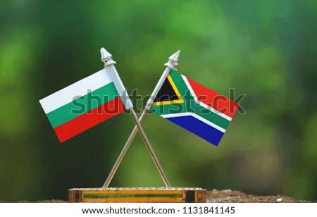 South Africa and Bulgaria small flag with blur green background
