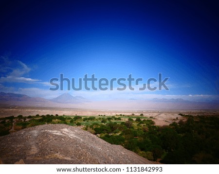 Landscape from Pukara de Quitor, a pre-Columbian archaeological site, of an oasis in a valley where the San Pedro River flows near San Pedro de Atacama, in the Atacama desert, in Chile, South America.