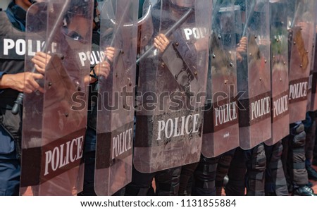Riot police coaches review crowd control