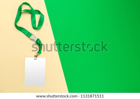 Blank white badge on color block background top view