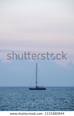 a lonely boat in the ocean